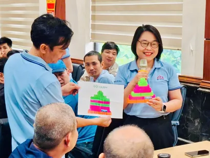 A team representative presenting their LEGO model